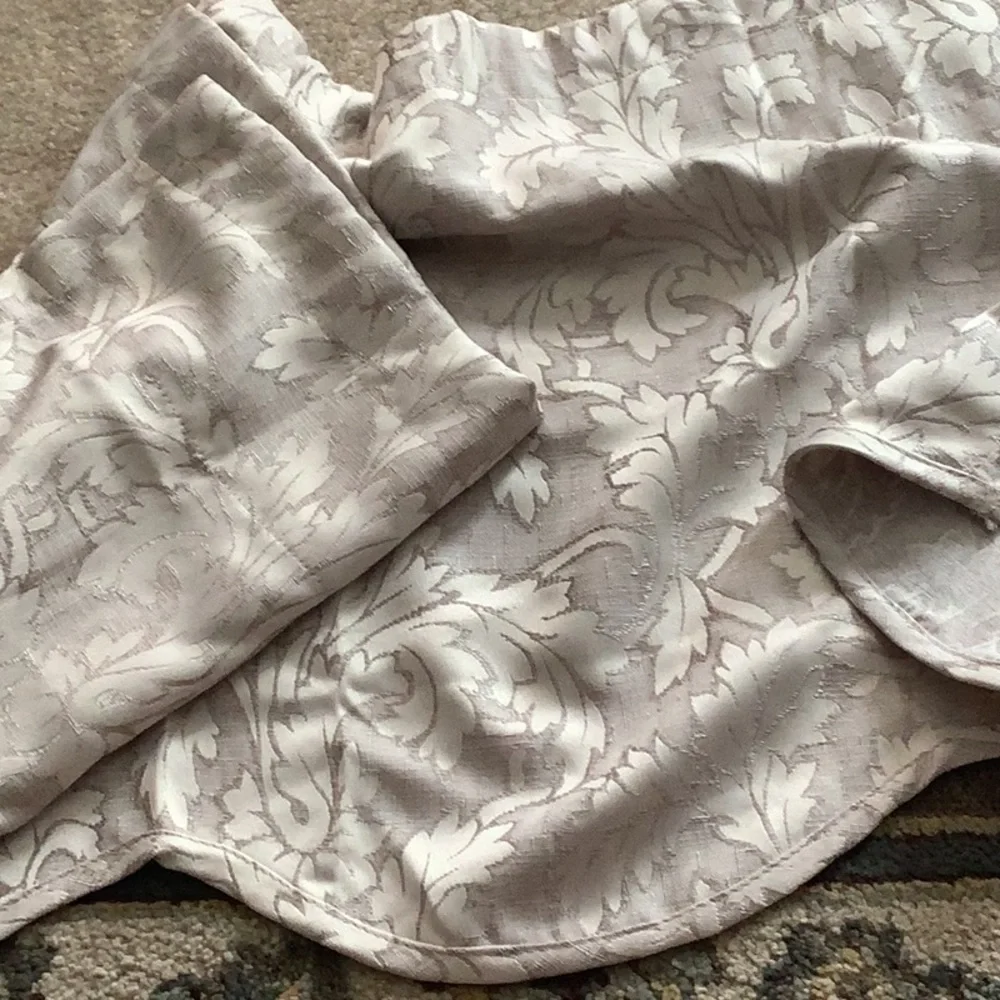 Valance set of (2) beige with pretty designs only used 6 months like new…
